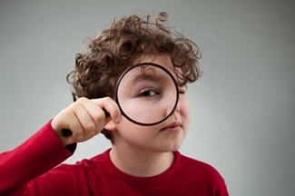 Boy with Magnifying Glass