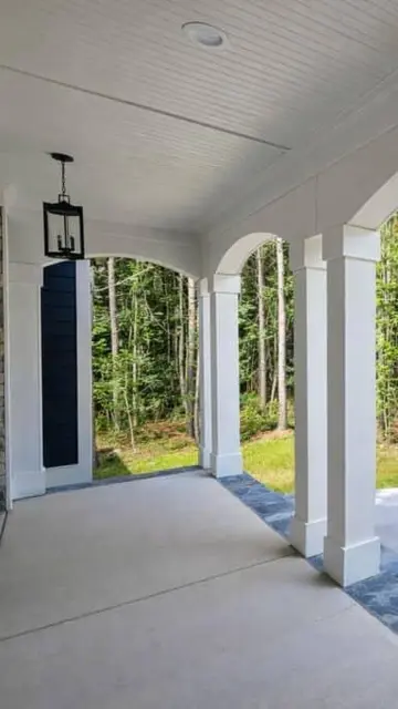 An arched front porch on a Travars home